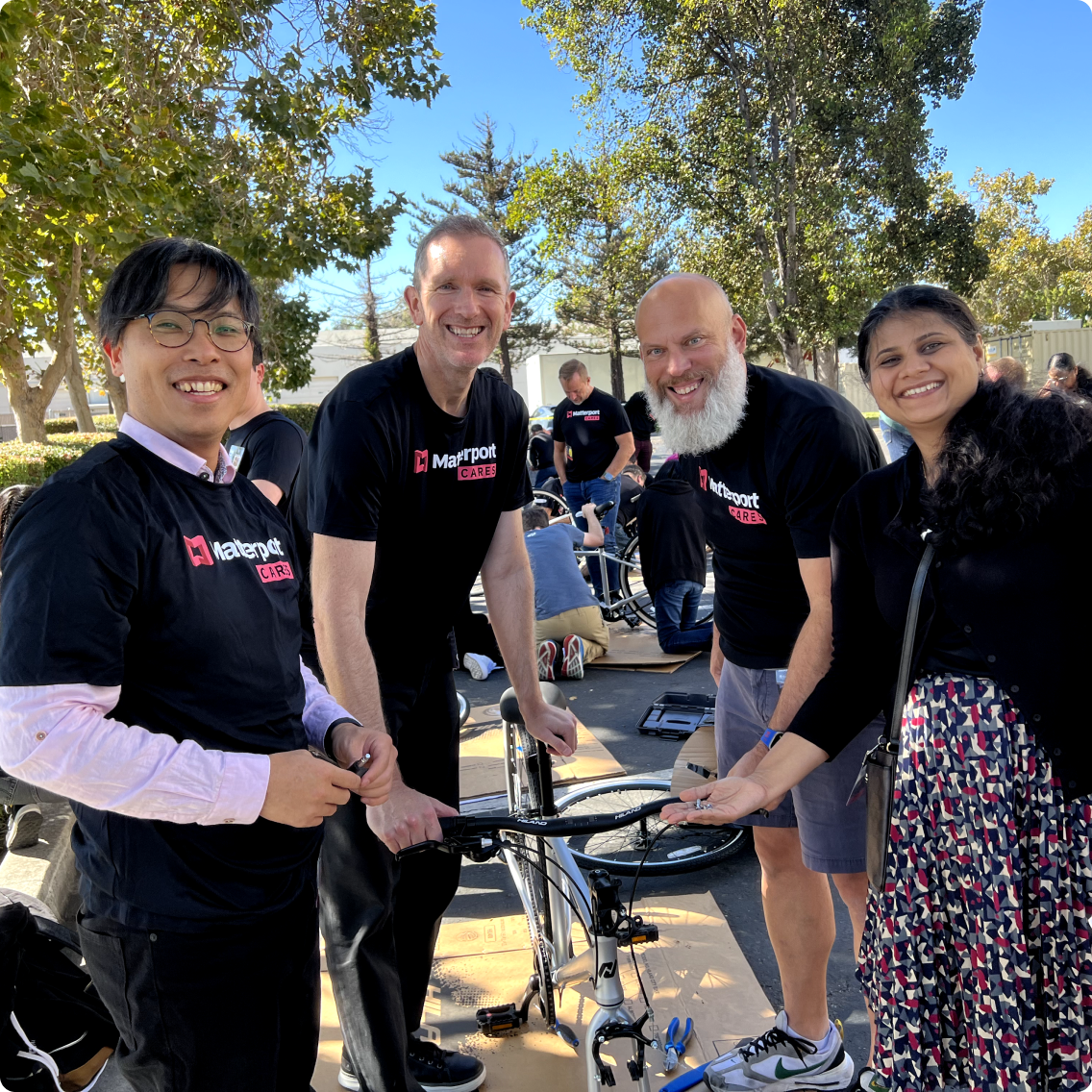 Matterport employees assembling bikes for charity